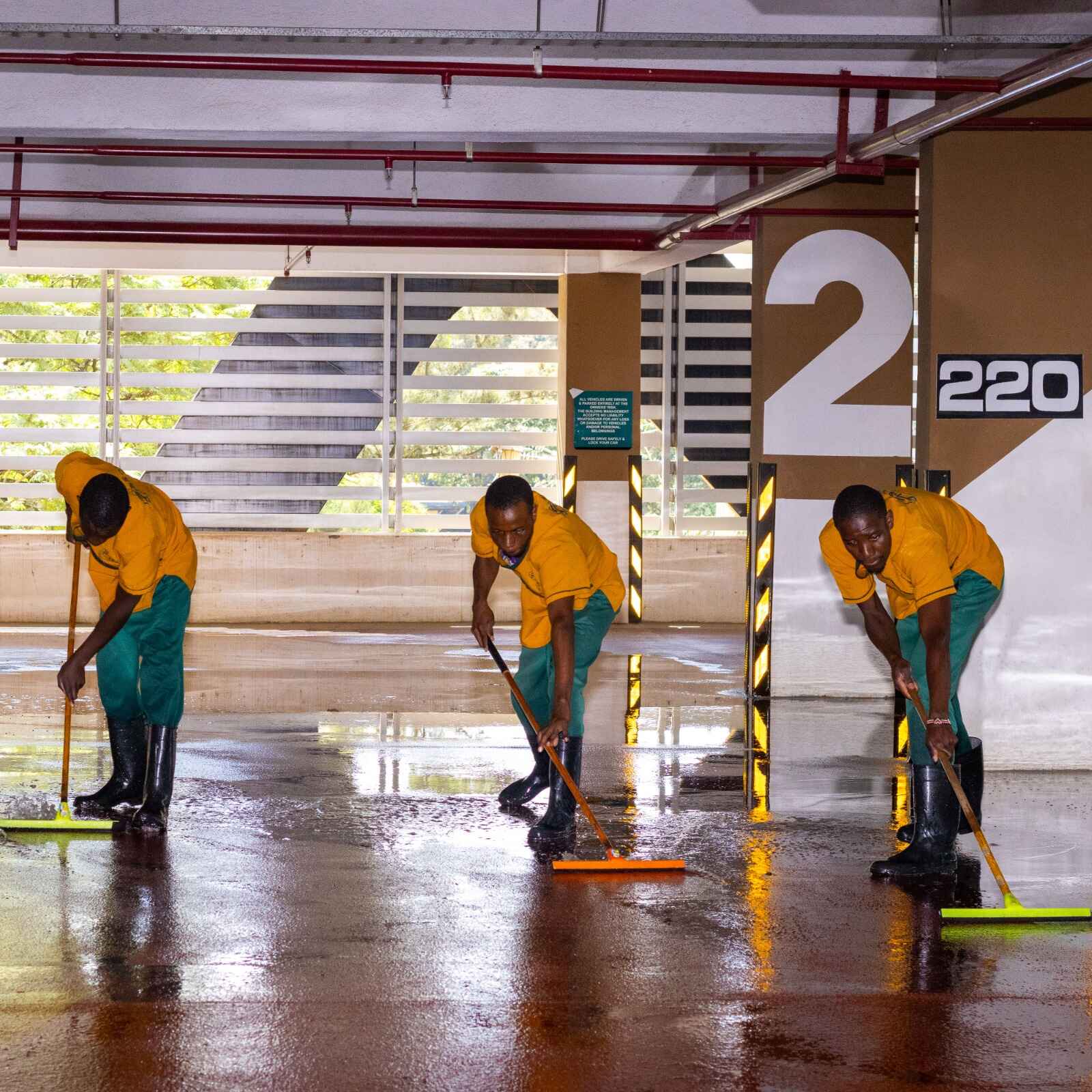 Industrial commercial cleaning services team cleaning large commercial facility floor area