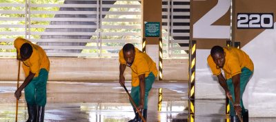 Industrial commercial cleaning services team cleaning large commercial facility floor area